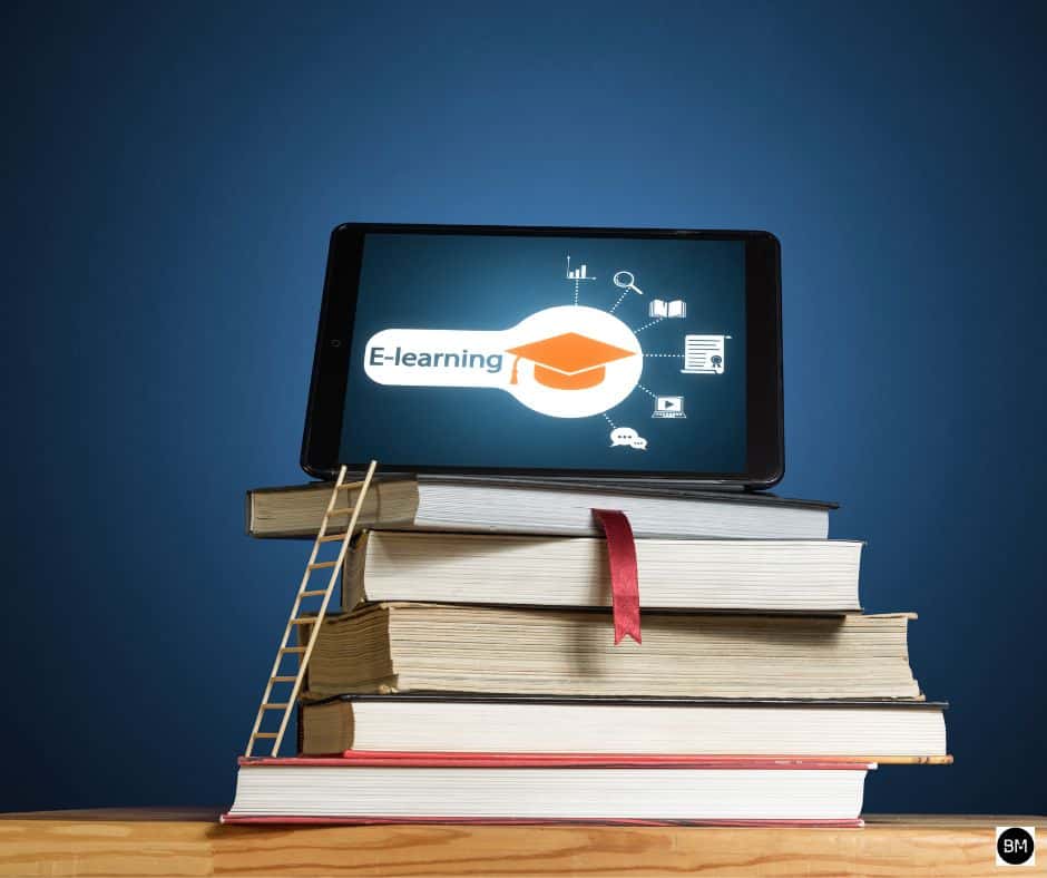 a picture with a pile of books and a tablet on top of it. 
